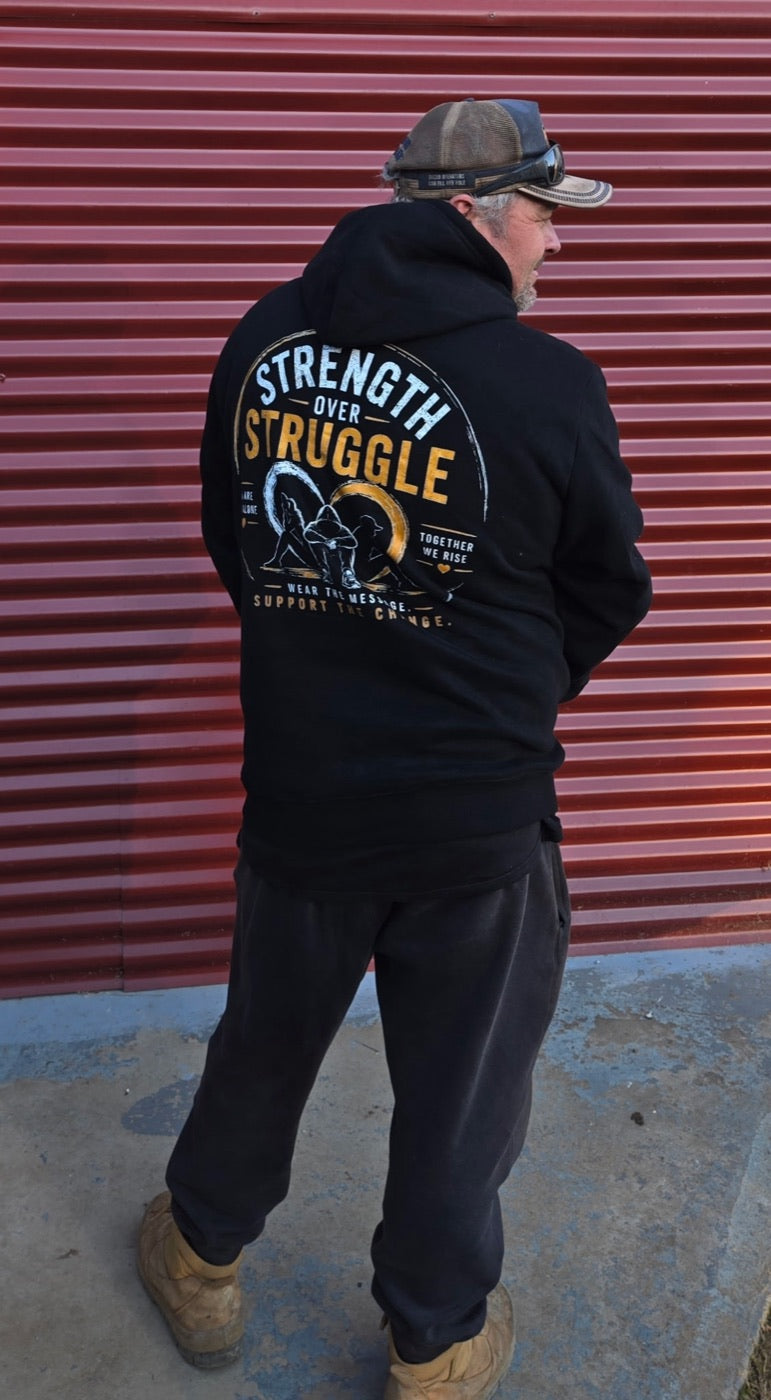 Someone wearing the Strength Over Struggle hoodie, seen from behind